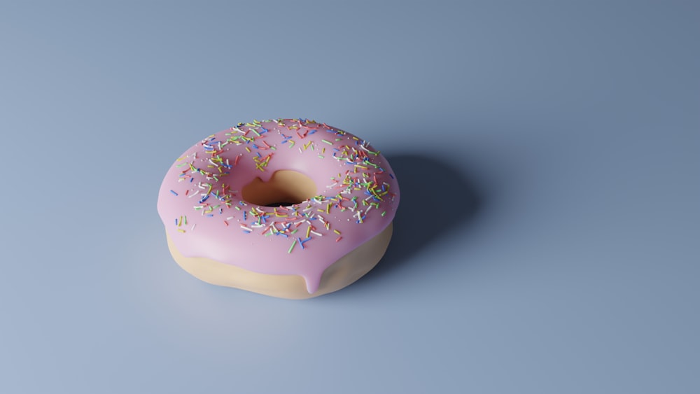 pink and white doughnut on white surface