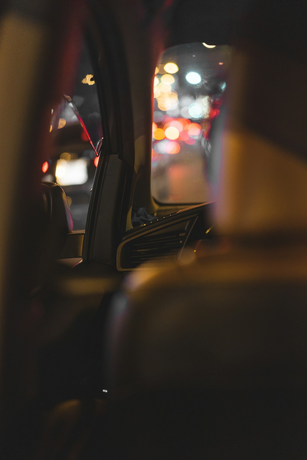 a view of a city street from inside a car