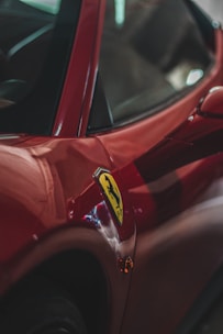 red car with yellow and white sticker