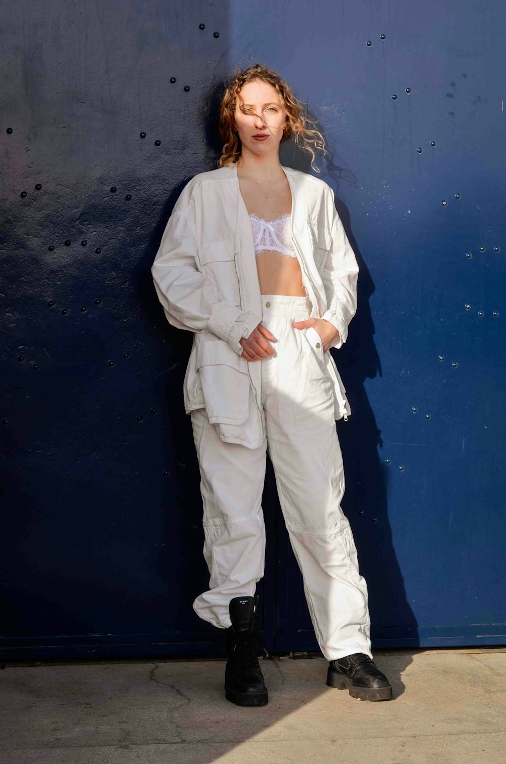 woman in white blazer and white dress pants