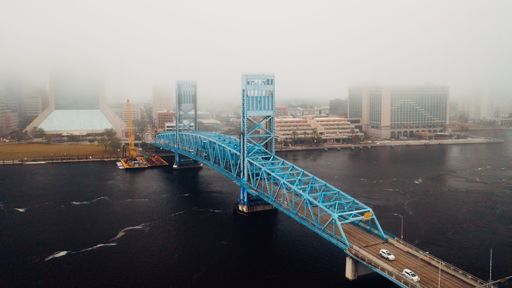 gray bridge over river during daytime