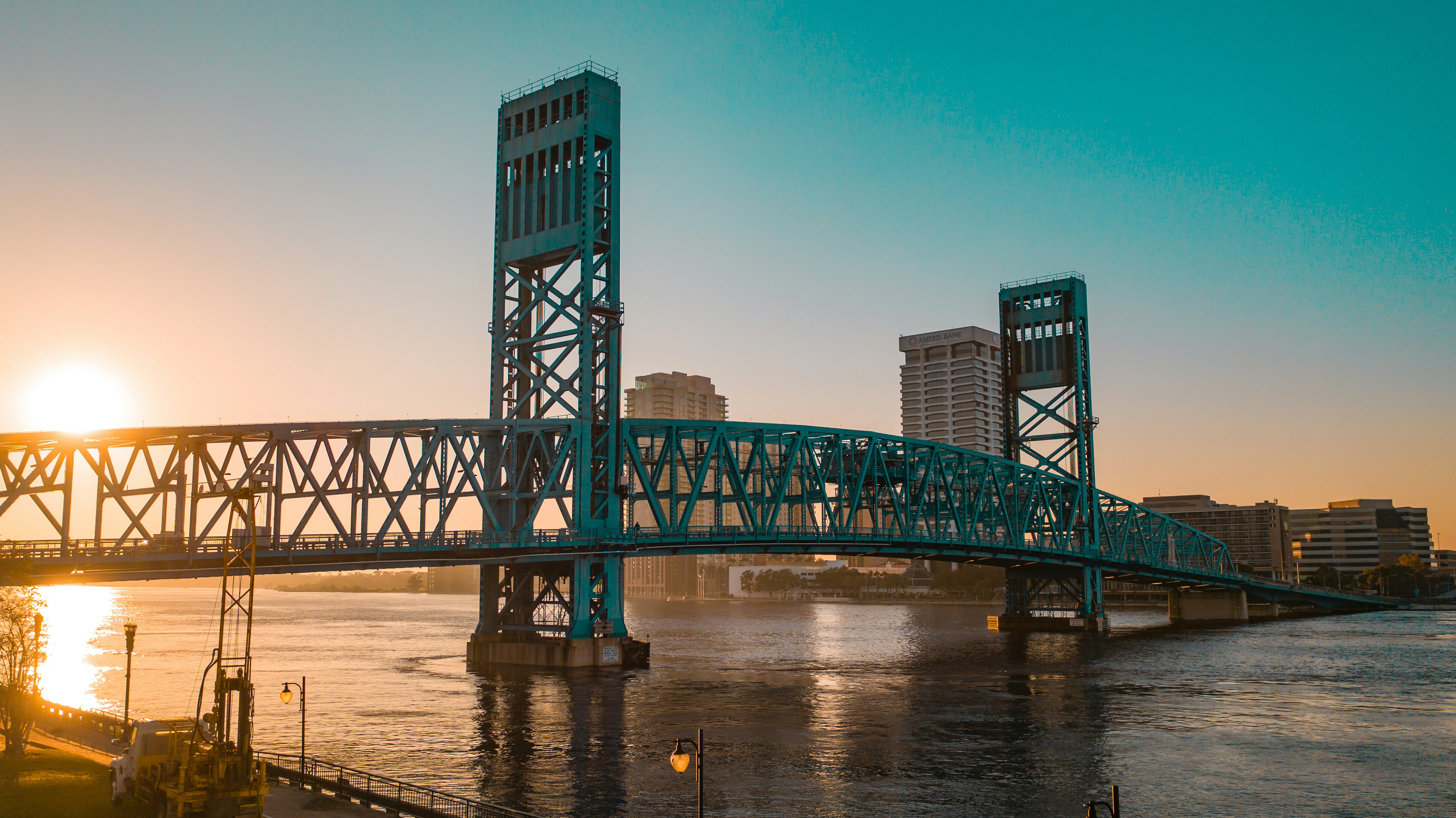 green metal bridge over river during daytime