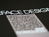 Text in a bold, modern font is prominently displayed against a dark background, with emphasis on the words 'FACE DESIGN'. Below, there is a block of smaller, blurry text that appears to be more detailed but is less legible.