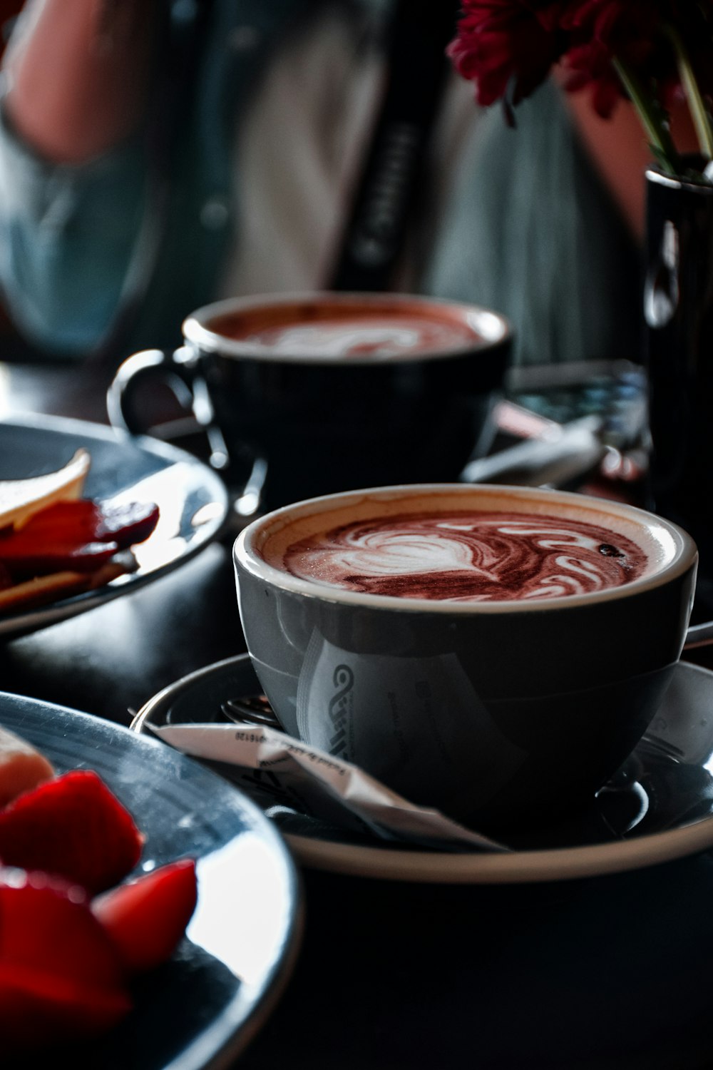 black ceramic mug with red liquid inside