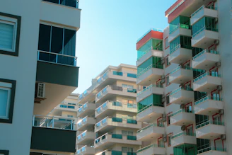 High-rise urban apartments with city skyline views.