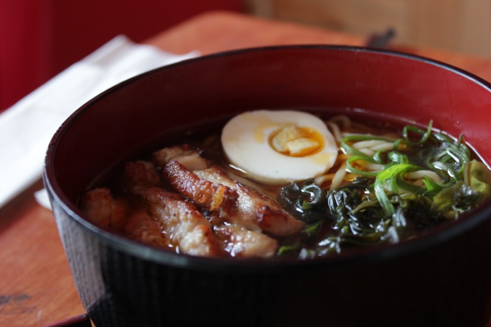 soup dish on black ceramic bowl