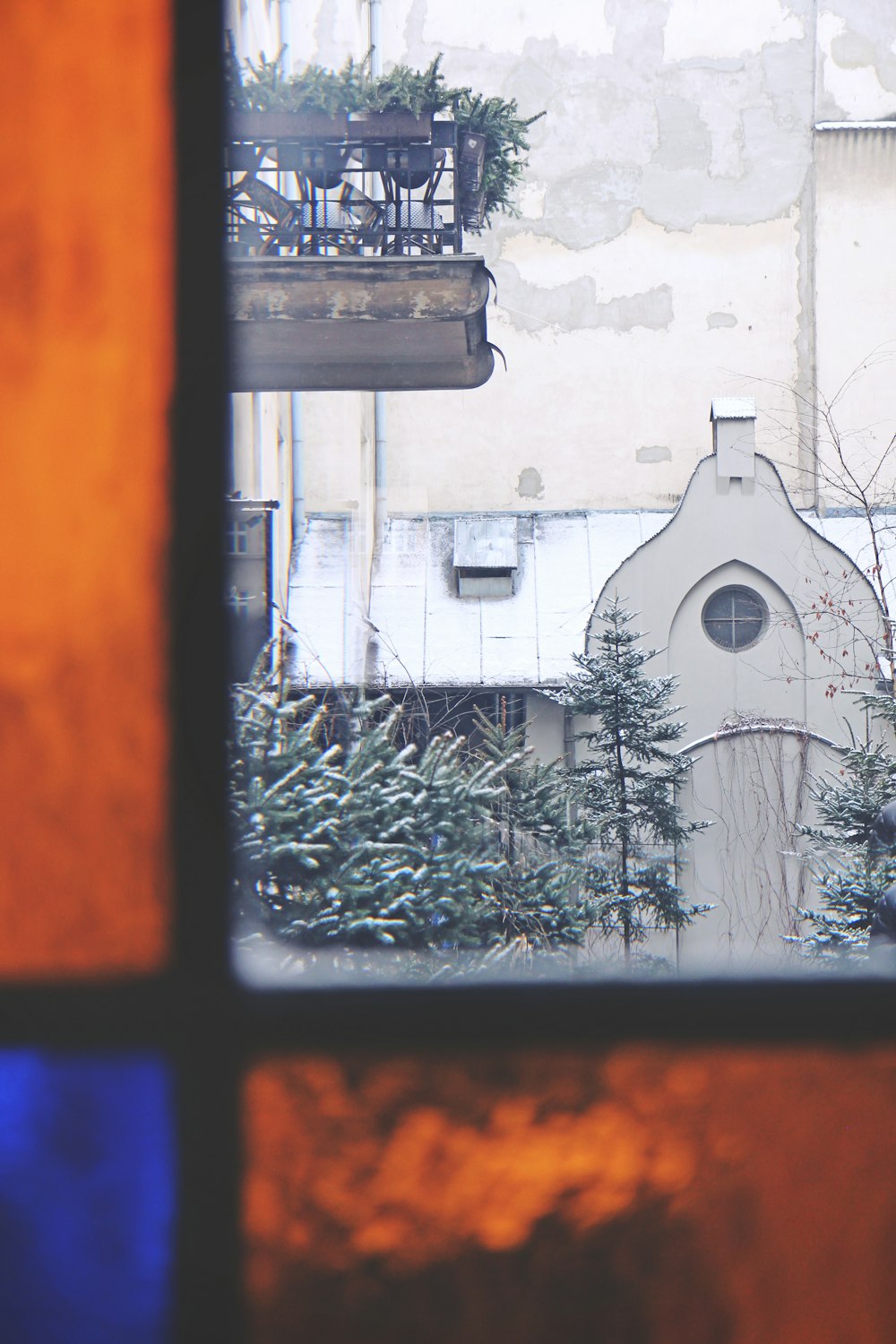 black framed glass window with snow