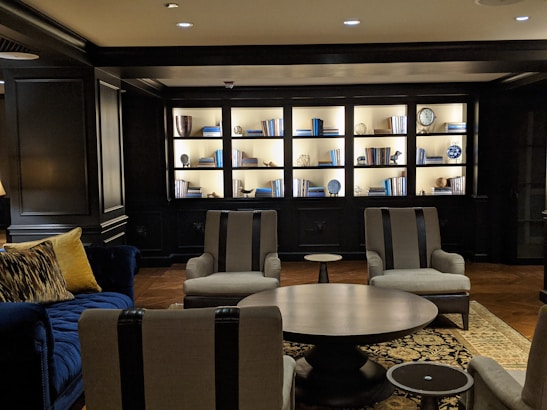 Cozy deluxe room seating area with plush chairs and elegant decor.