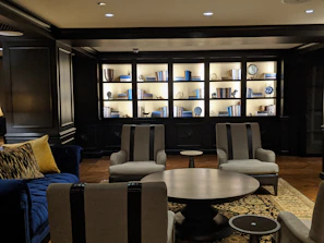 Inviting seating area in the room with comfortable chairs and soft lighting.