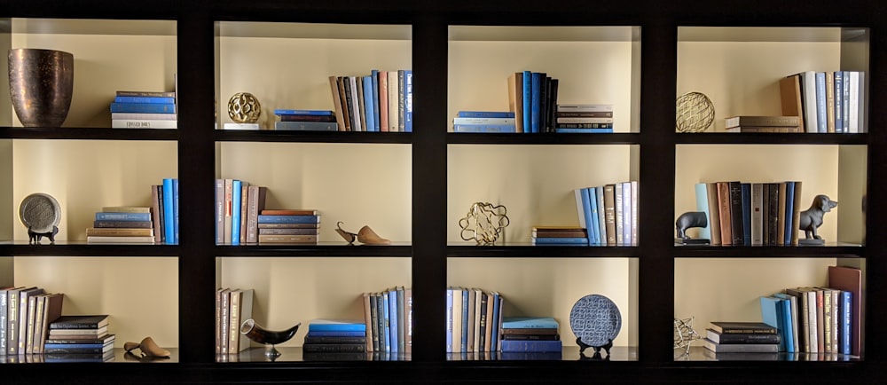 books on black wooden shelf