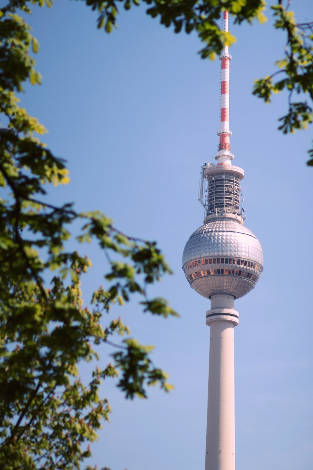 white and red tower under blue sky during daytime