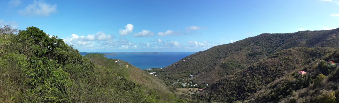 Green hills of Pleasant Valley on Tortola above the blue sea