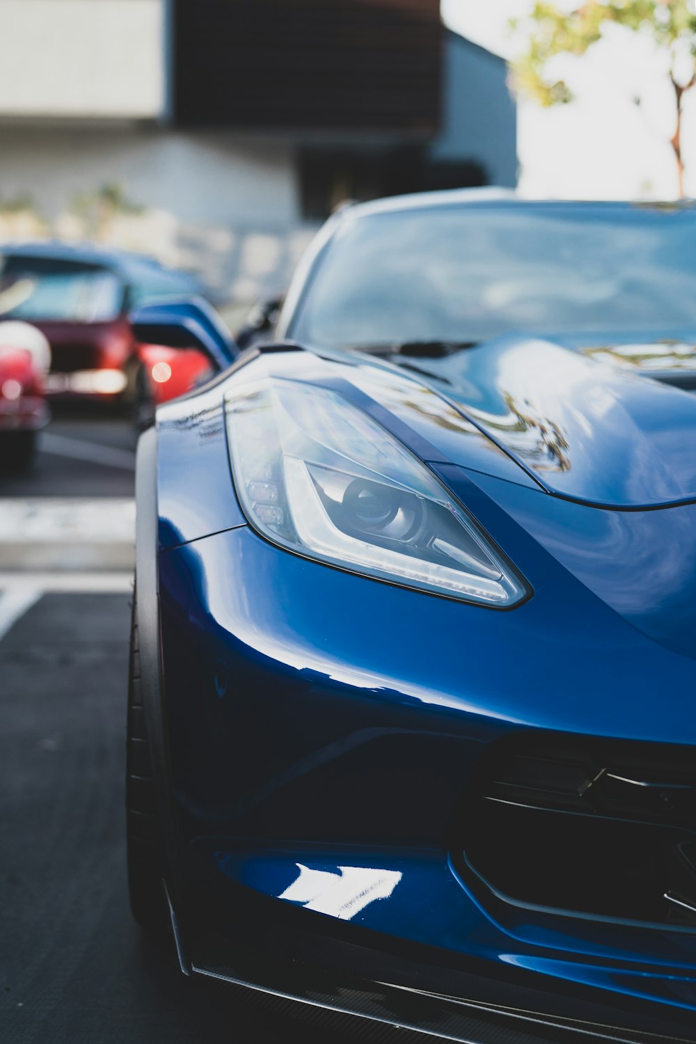 blue ferrari 458 italia on road during daytime