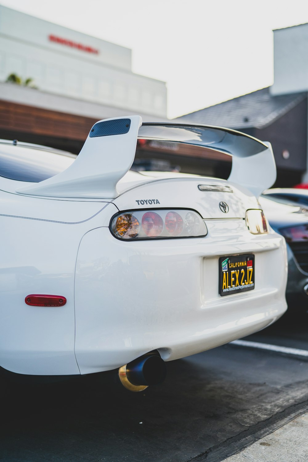 white porsche 911 parked on parking lot during daytime