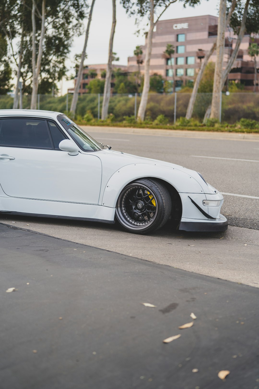 white porsche 911 on road during daytime