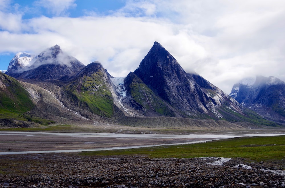 gray and white mountain under white cloudy sky during daytime