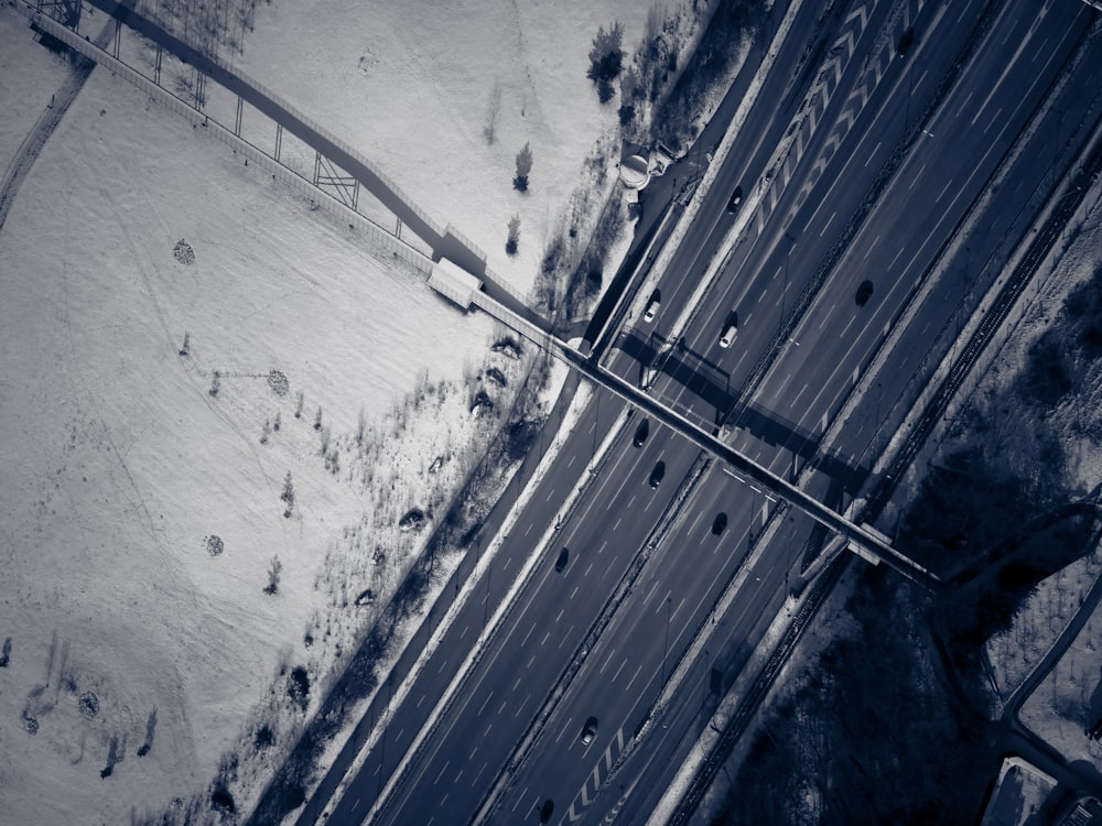 an aerial view of a road in the snow