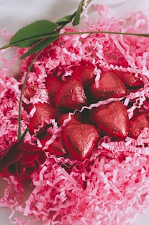 red and white petals on white and pink floral textile