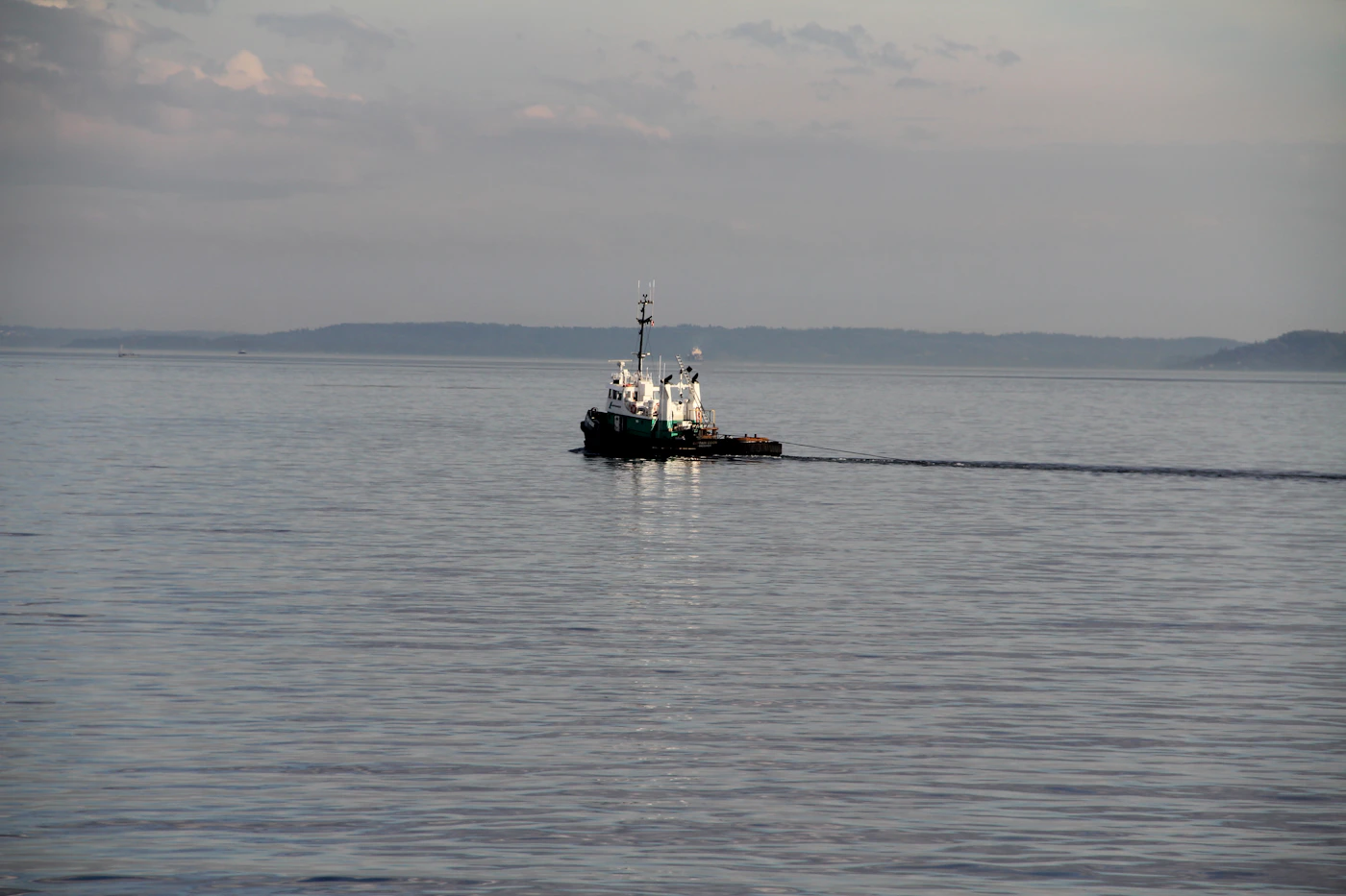 A white and black commercial fishing vessel at sea, representing the factors that can reduce but usually not eliminate a claim