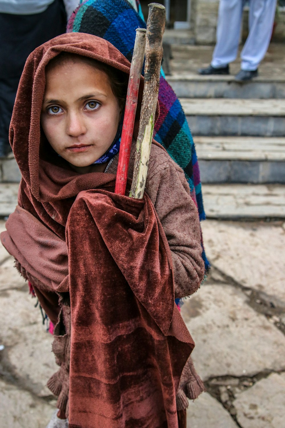 boy in red and blue scarf