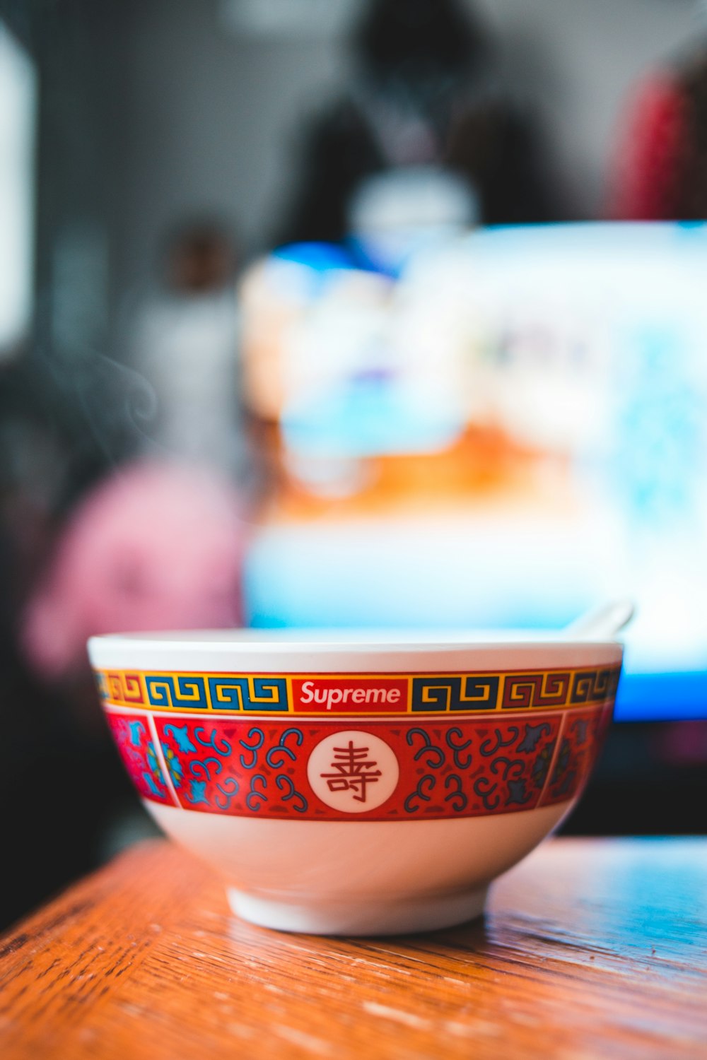 white and orange ceramic bowl