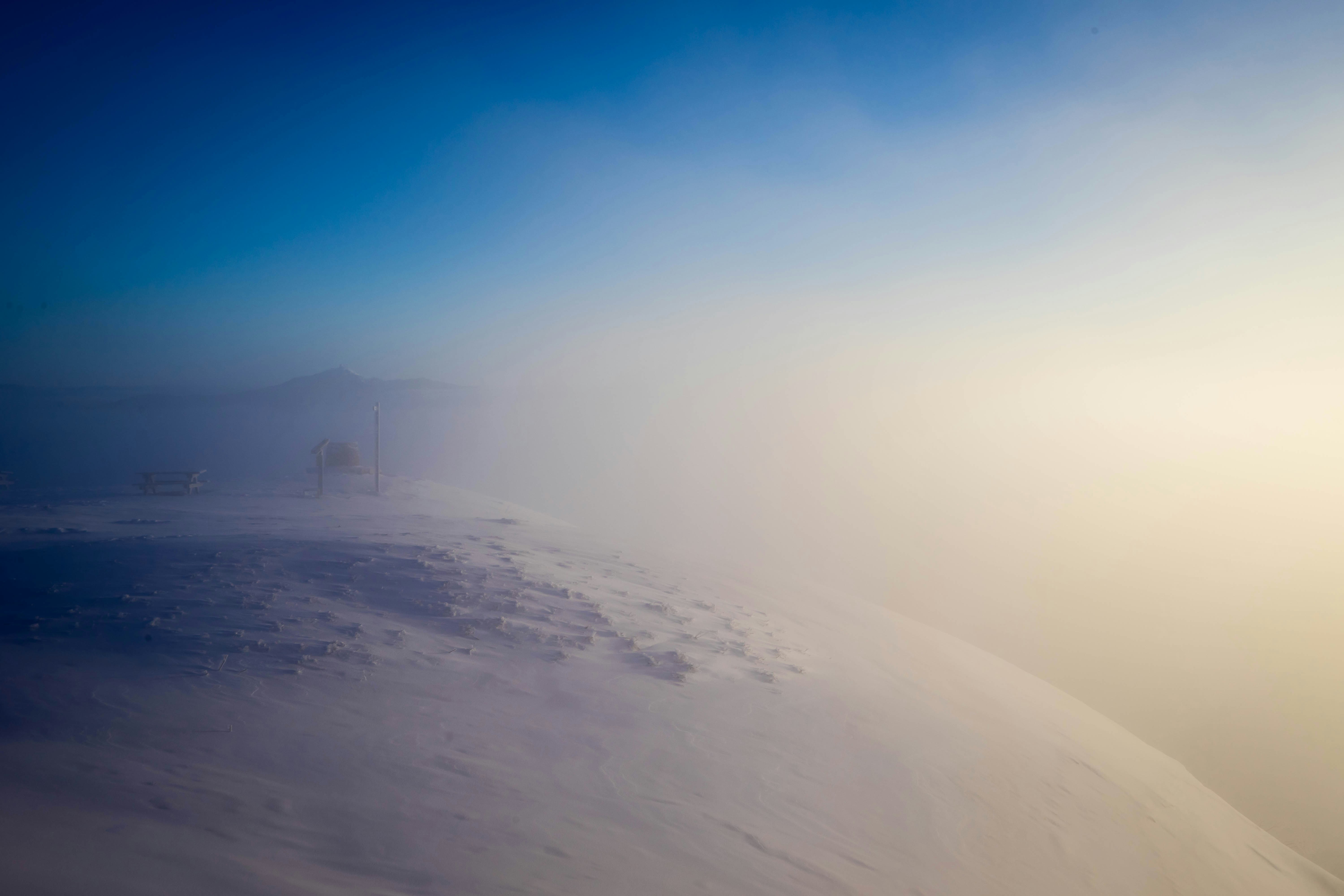 white sand under blue sky during daytime
