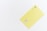 A minimalistic yellow card with a chip and contactless payment symbol is positioned against a white background. The word 'Business' is printed near the contactless symbol.