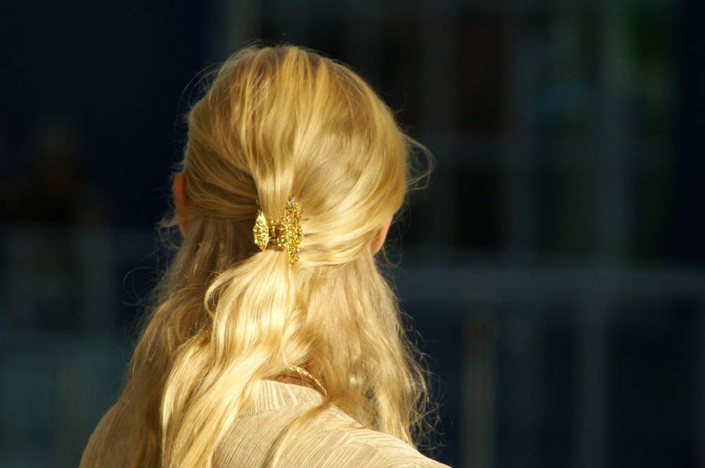 woman with blonde hair wearing gold crown