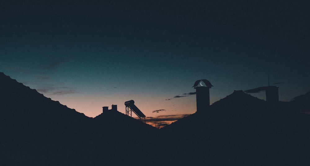 silhouette of building during night time