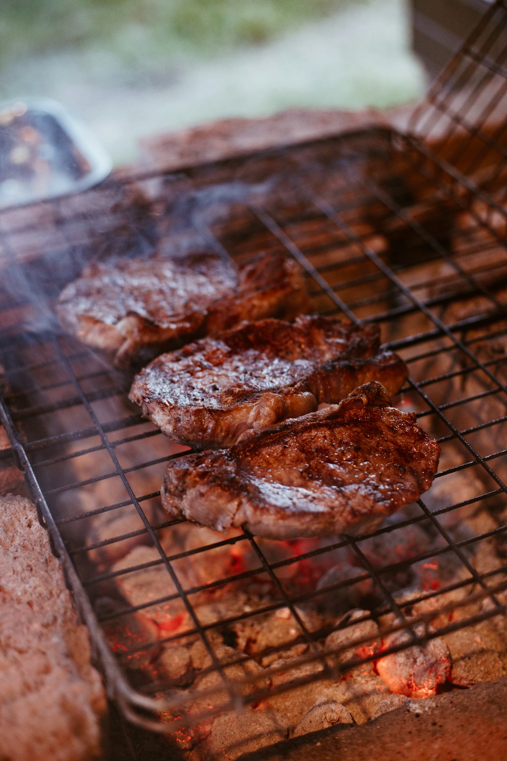 grilled meat on charcoal grill