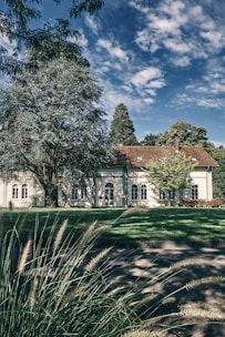 A completed building with a beautiful landscape surrounding it.