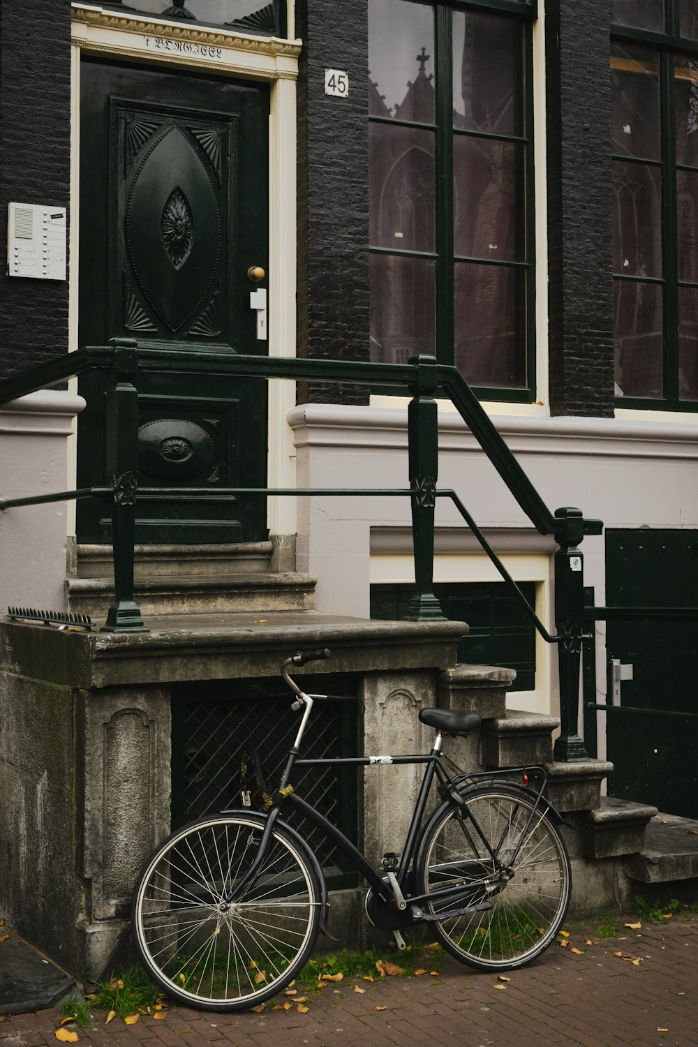 black and gray bicycle on brown concrete staircase