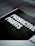 A book titled 'Productive Profits' is placed on a surface with a geometric patterned background. The cover is mostly dark with bold, white text capturing the main title. Additional text is visible but less prominent, suggesting a focus on scaling or business strategies.