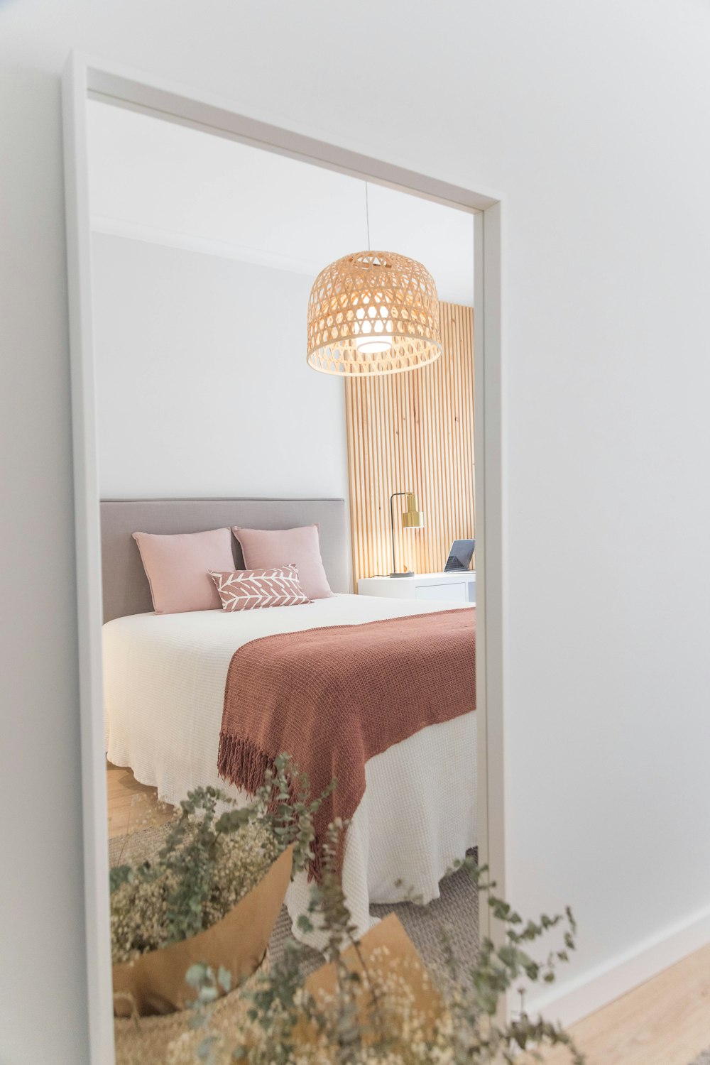 white bed with red and white bed linen