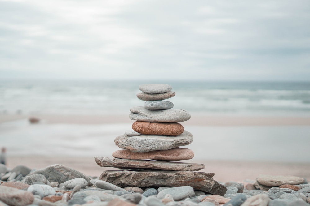stack of stones on beach shore during daytime