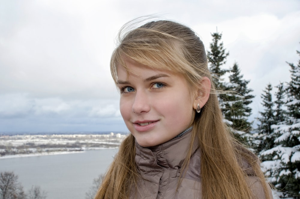 girl in gray jacket smiling