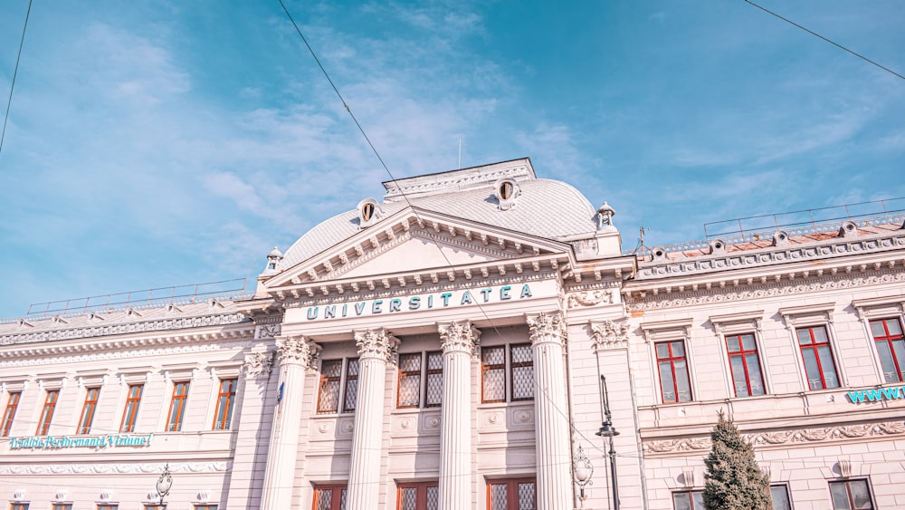 white concrete building under blue sky during daytime