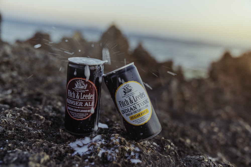 black and white can on brown and black soil