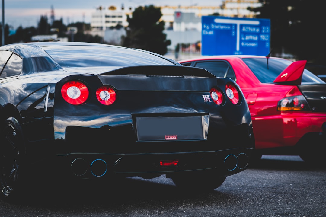 black ferrari 458 italia on road during daytime