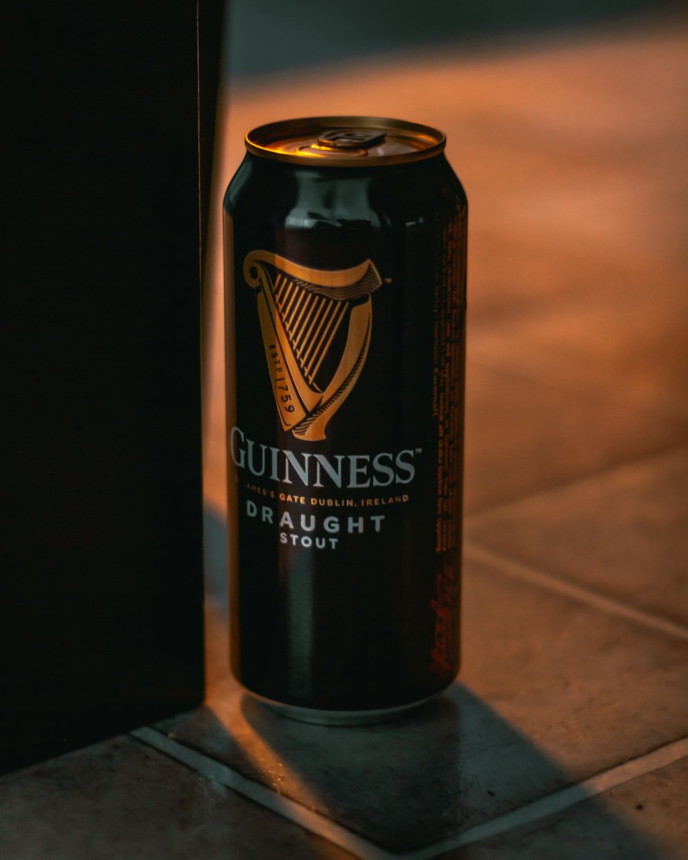 black and brown can on brown wooden table