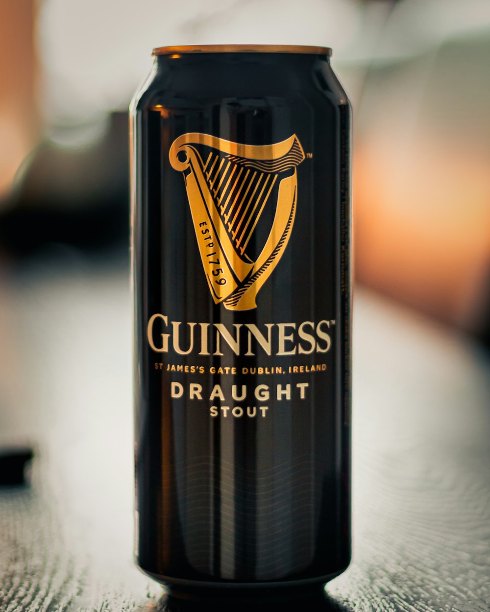 a can of guinness draught stout sitting on a table