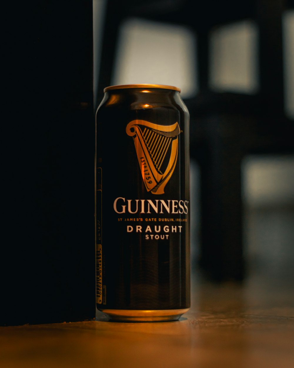 black and brown can on brown wooden table