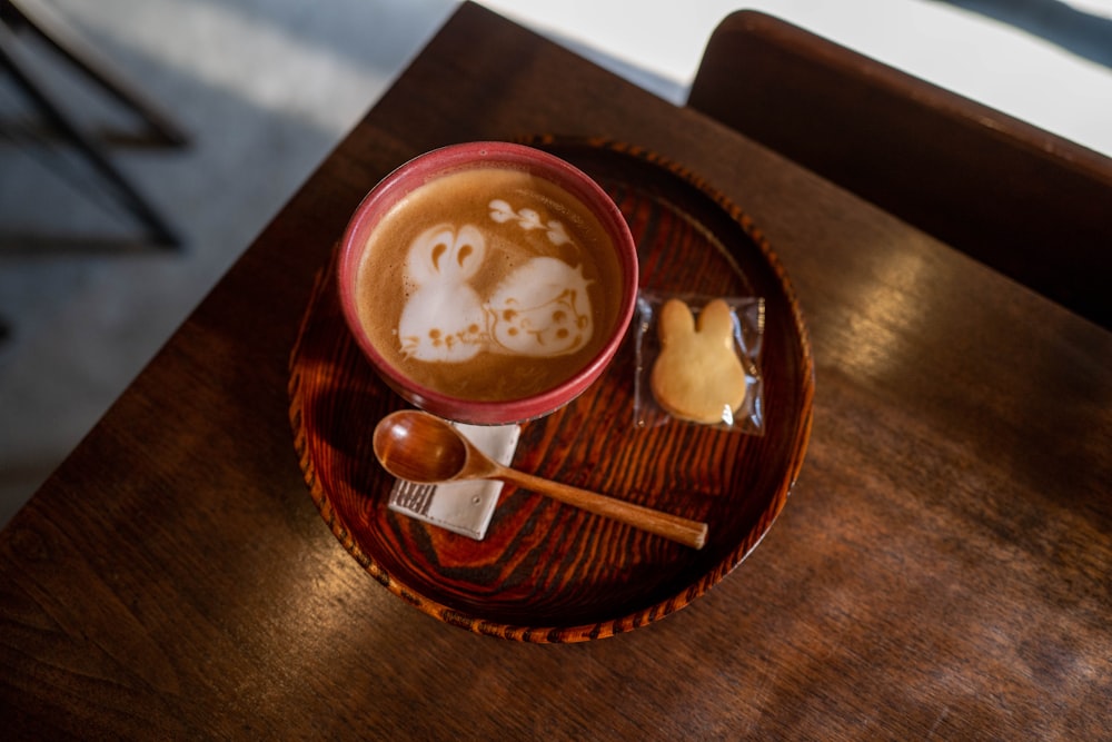 red and white ceramic mug with coffee