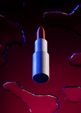 red and blue pen on red heart illustration