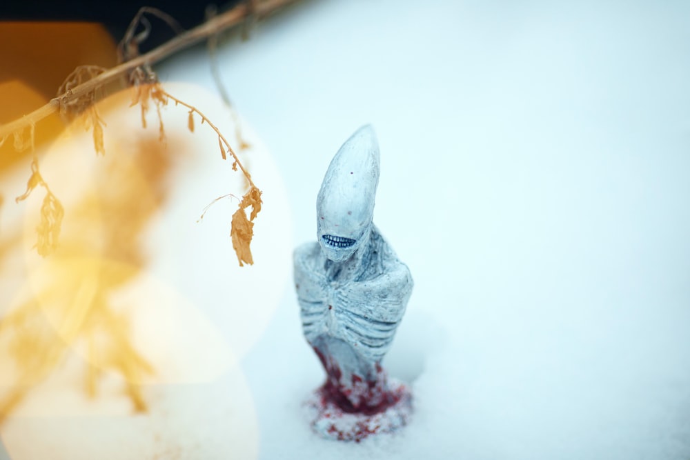 white angel figurine on white surface