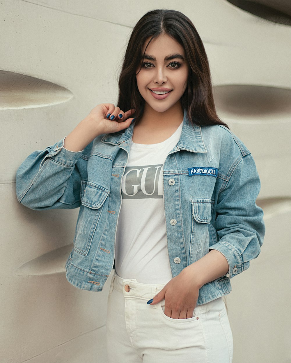 woman in blue denim jacket sitting on white ceramic bathtub