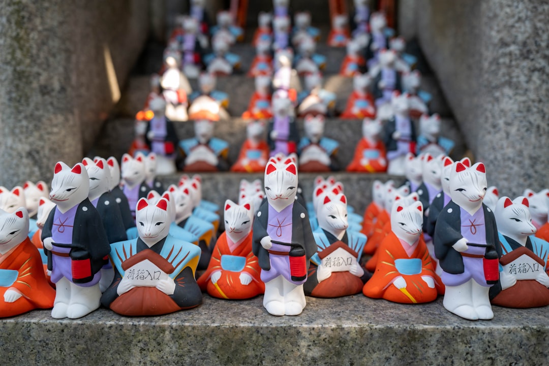 white red and blue snowman figurine, Inari figures