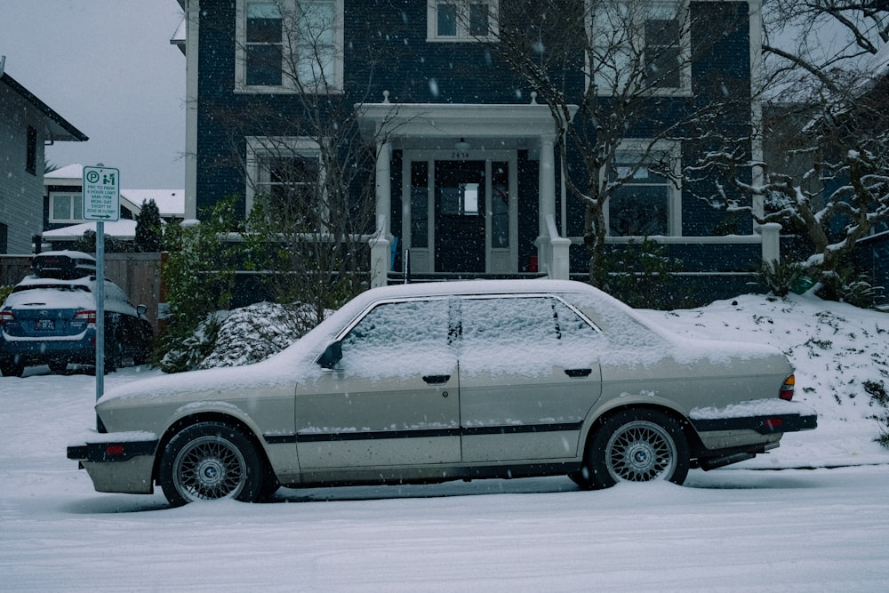 white sedan parked near white building