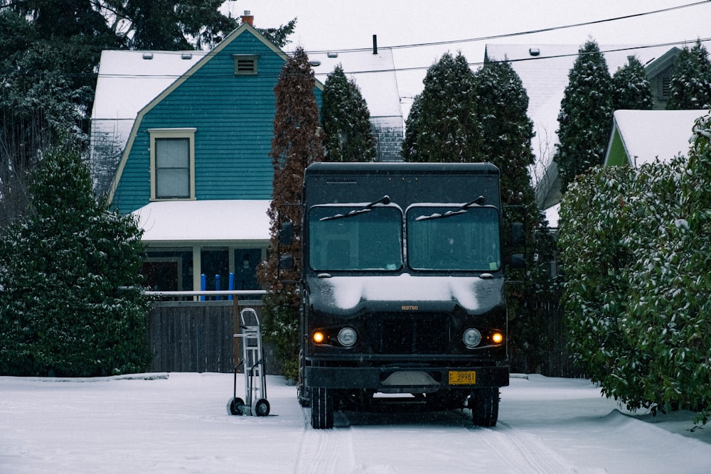 green and brown van in front of brown house