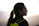man in black and green hoodie kissing woman in black shirt